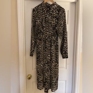 Shirt dress, button up, collar and attached belt.